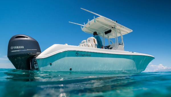 Edgewater 245CC Edgewater 245CC 2025 boat on clear blue water with Yamaha engine.