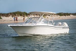 Grady-White Freedom 255 2025 Grady-White Freedom 255 boat on water near sandy beach.