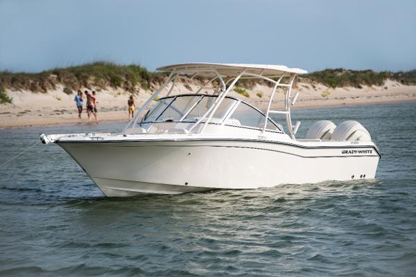 Grady-White Freedom 255 2025 Grady-White Freedom 255 boat on water near sandy beach.