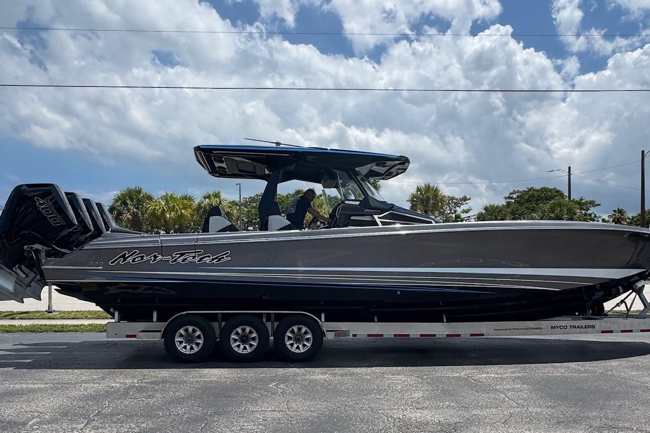 Nor-Tech 400 Supersport 2025 Nor-Tech 400 Supersport boat on trailer under cloudy sky.