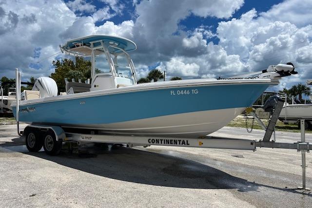 Everglades 243 Center Console 2022 Everglades 243 Center Console boat on trailer under cloudy sky.