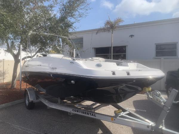 Hurricane SS188 2023 Hurricane SS188 boat on trailer, parked outdoors near a building.