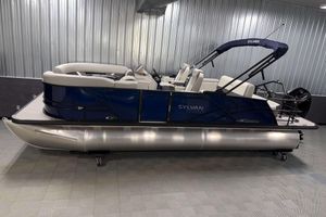 Sylvan Mirage X3 CLZ DH 2026 Sylvan Mirage X3 CLZ DH pontoon boat in showroom, featuring sleek design and modern amenities.