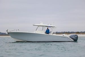 Cobia 350 Center Console 2020 Cobia 350 Center Console boat on water with person at helm.