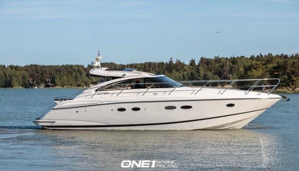 Princess V45 2007 Princess V45 yacht cruising on a serene lake with forested background.
