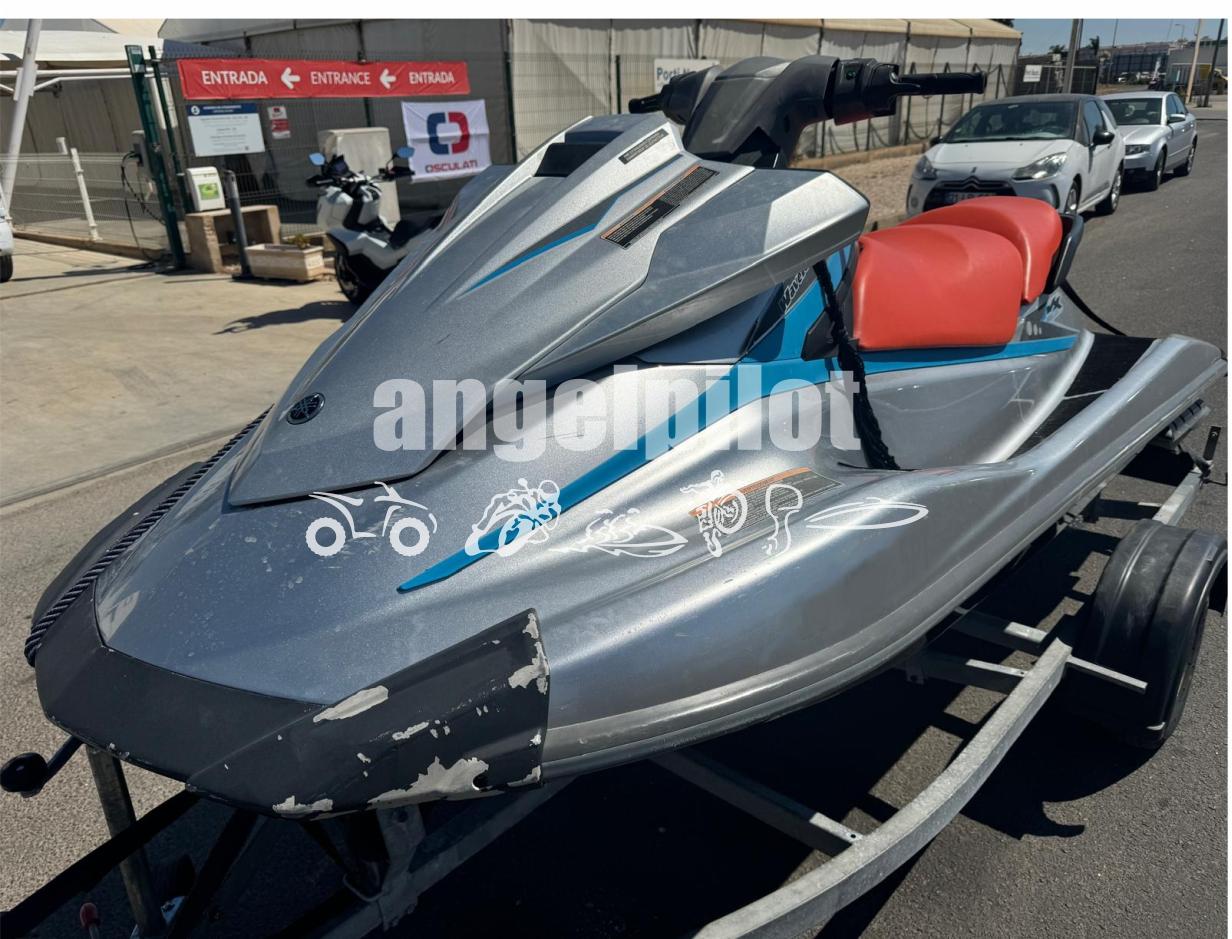 Yamaha WaveRunner VX Deluxe 2015 Yamaha WaveRunner VX Deluxe on trailer, gray with red seat, outdoor setting.