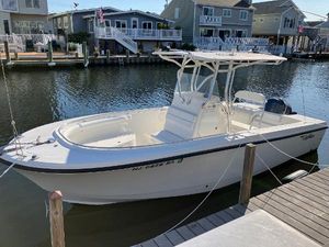 Edgewater 228CC 2008 Edgewater 228CC boat docked in a residential canal.