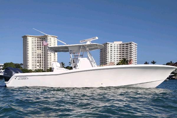 Invincible 33 Open Fisherman 2017 Invincible 33 Open Fisherman boat on water, with city skyline background.