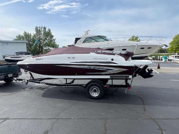 Hurricane SS 188 IO 2020 Hurricane SS 188 IO boat on trailer, parked outdoors under a clear sky.