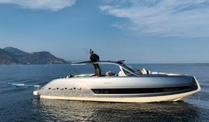 Invictus TT460 2023 Invictus TT460 yacht on calm sea with scenic mountain backdrop.