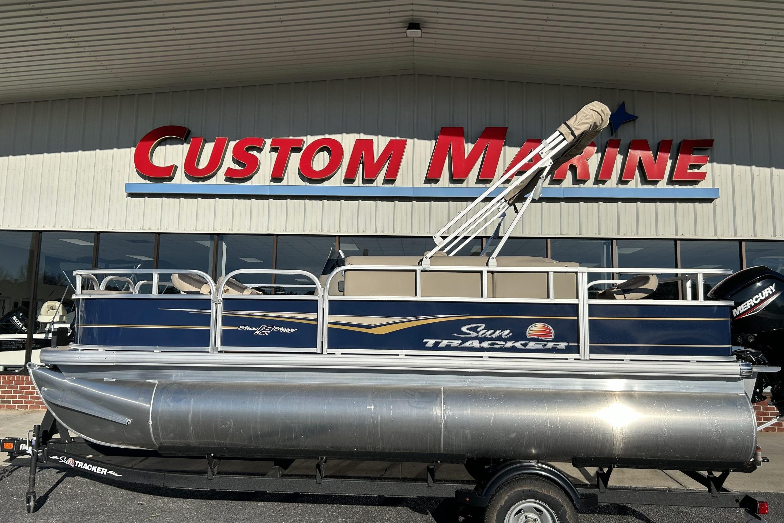 Sun Tracker Bass Buggy 18 DLX 2024 Sun Tracker Bass Buggy 18 DLX pontoon boat at Custom Marine dealership.