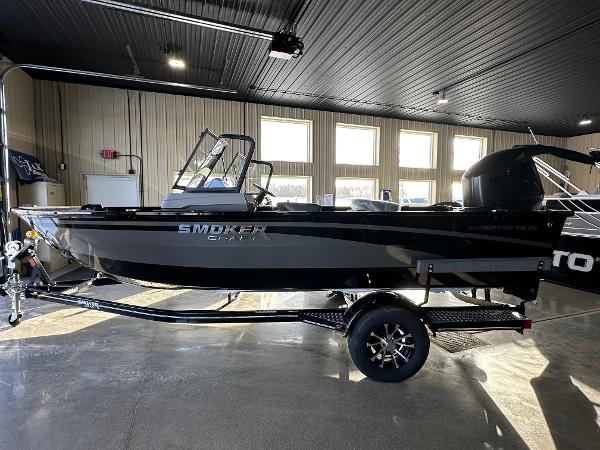 Smoker Craft Adventurer 188 DC 2025 Smoker Craft Adventurer 188 DC boat in showroom, side view.
