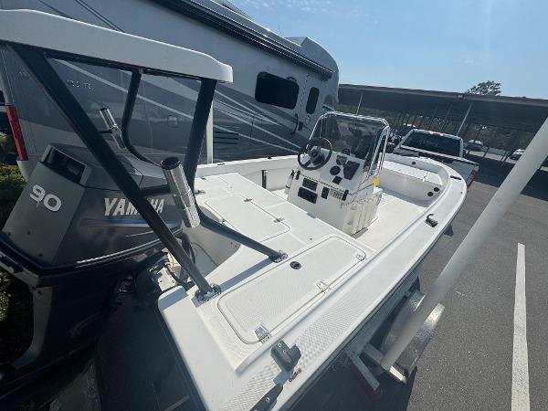 Custom Flats Custom Flats boat, 2001 model, with Yamaha 90 engine, parked near RV and truck.