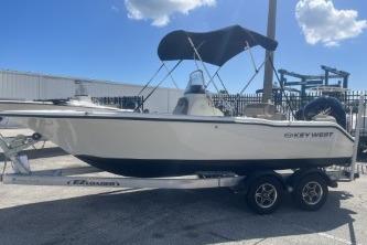 Key West 203 DFS 2022 Key West 203 DFS boat on trailer with canopy, parked outdoors.
