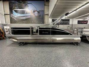 Barletta ARIA 22UC 2025 Barletta ARIA 22UC pontoon boat displayed in showroom with sleek design.