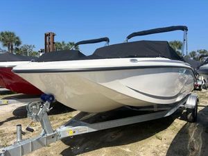 Bayliner Element M17 2025 Bayliner Element M17 boat on trailer, covered, outdoors.
