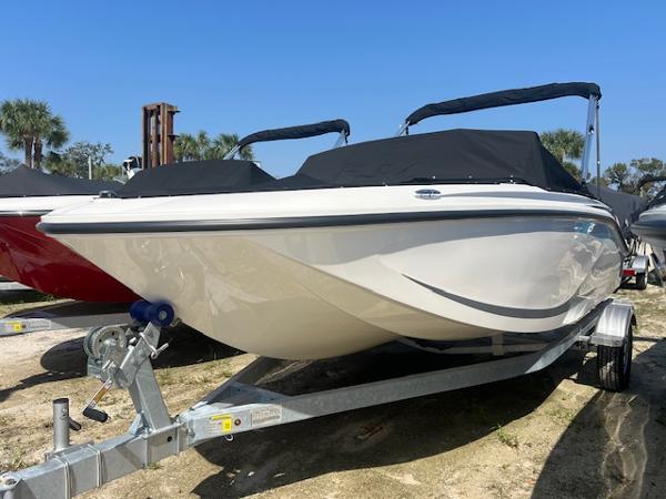Bayliner Element M17 2025 Bayliner Element M17 boat on trailer, covered, outdoors.