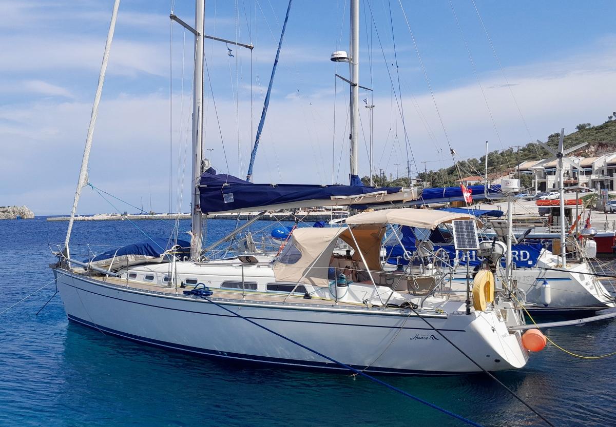 Hanse 371 Sailboat Hanse 371, 2001 model, docked in a marina with clear blue water.