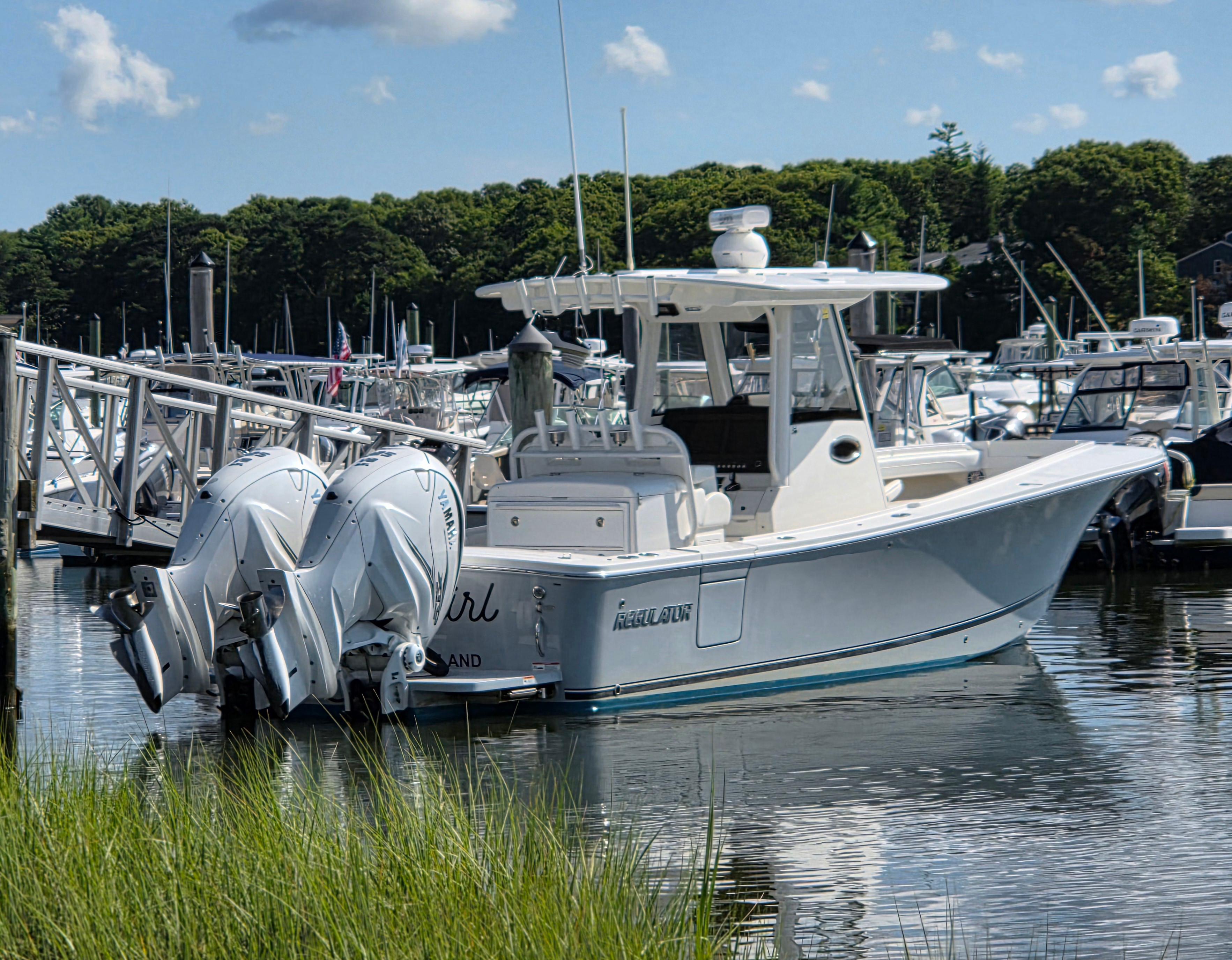 Regulator 31 CC 2021 Regulator 31 CC boat docked with twin Yamaha engines.