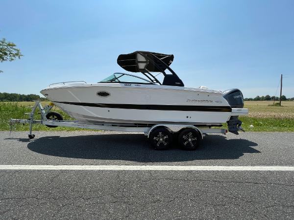 Chaparral 250 OSX 2024 Chaparral 250 OSX boat on a trailer, side view.