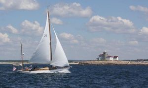 Concordia 39 Yawl Sailing Concordia 39 Yawl near lighthouse under blue sky, 1960 model.