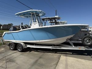 Tidewater 232 CC Adventure 2025 Tidewater 232 CC Adventure boat on trailer, blue hull, sunny day.