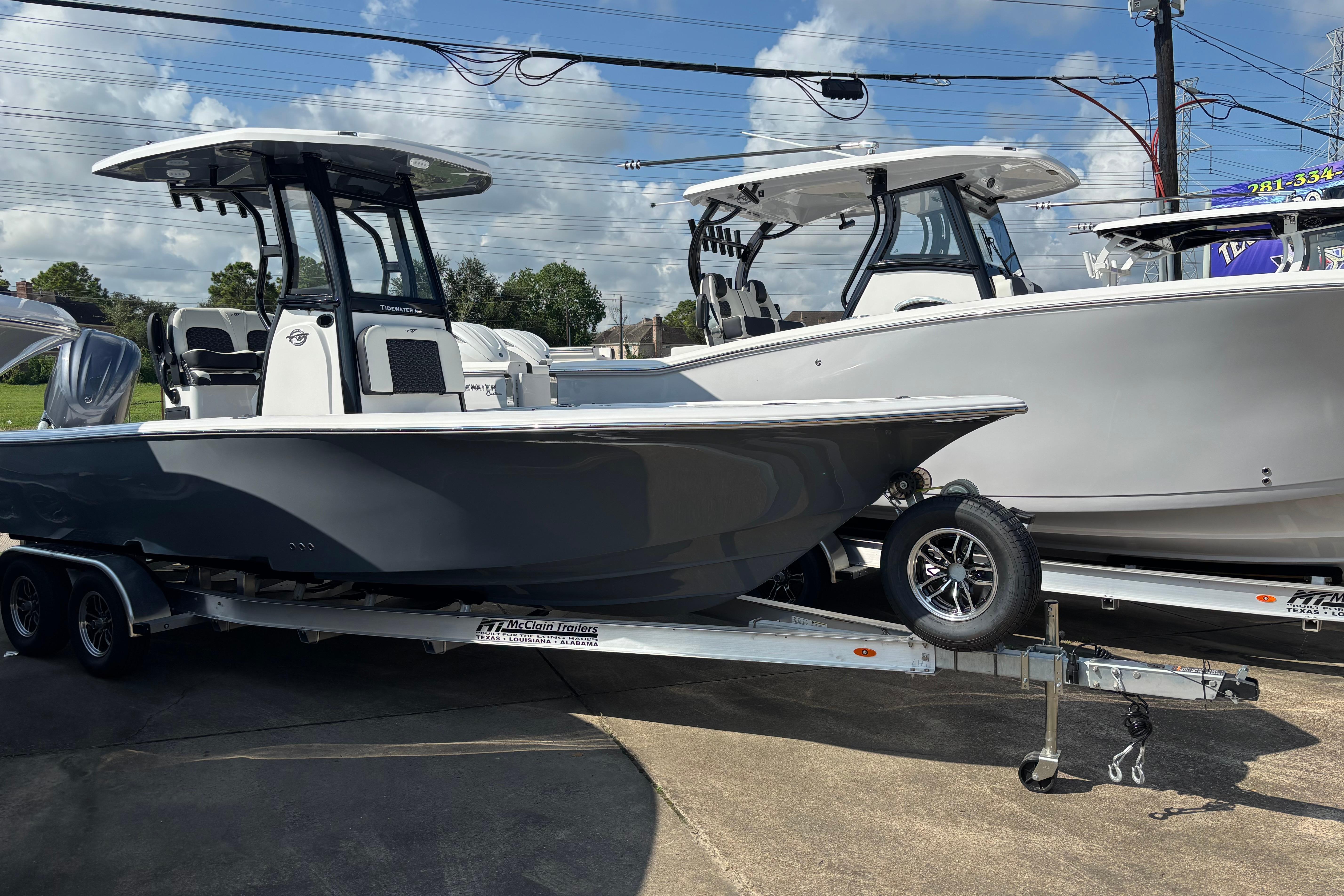 Tidewater 2500 Carolina Bay 2026 Tidewater 2500 Carolina Bay boat on trailer, parked outdoors under a clear sky.