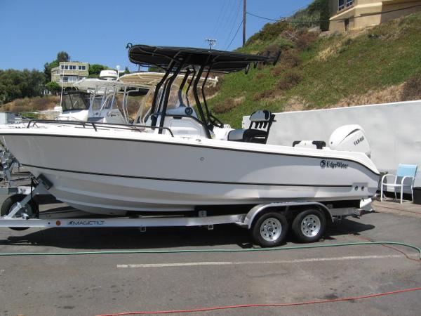 Edgewater 208 WATCHMAN CC 2025 Edgewater 208 WATCHMAN CC boat on trailer, parked outdoors.