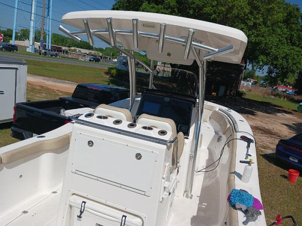 Sea Fox 288 Commander 2016 Sea Fox 288 Commander boat with T-top and center console, parked outdoors.