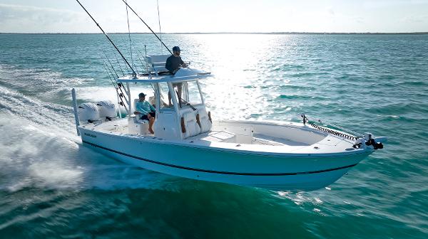 Regulator 30XO 2026 Regulator 30XO boat cruising on open water under clear skies.