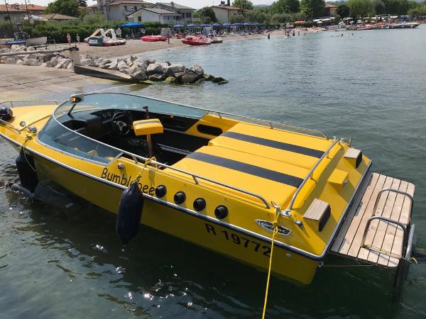 Custom Kobusch Vlotho R1519 Yellow 1976 Custom Kobusch Vlotho R1519 boat named Bumblebee docked at a lakeside.