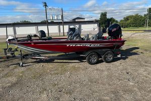 Tracker Pro Team 195 TXW Tournament Edition 2024 Tracker Pro Team 195 TXW Tournament Edition boat on trailer, parked outdoors.