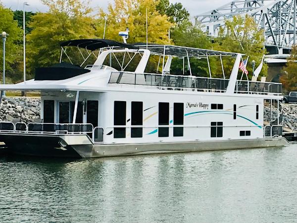 Thoroughbred 67x17 Thoroughbred 67x17 2016 houseboat docked near trees and bridge.