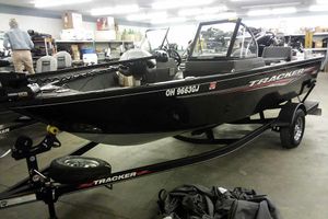 Tracker Pro Guide V-175 WT 2022 Tracker Pro Guide V-16 WT boat in showroom, black exterior, on trailer.