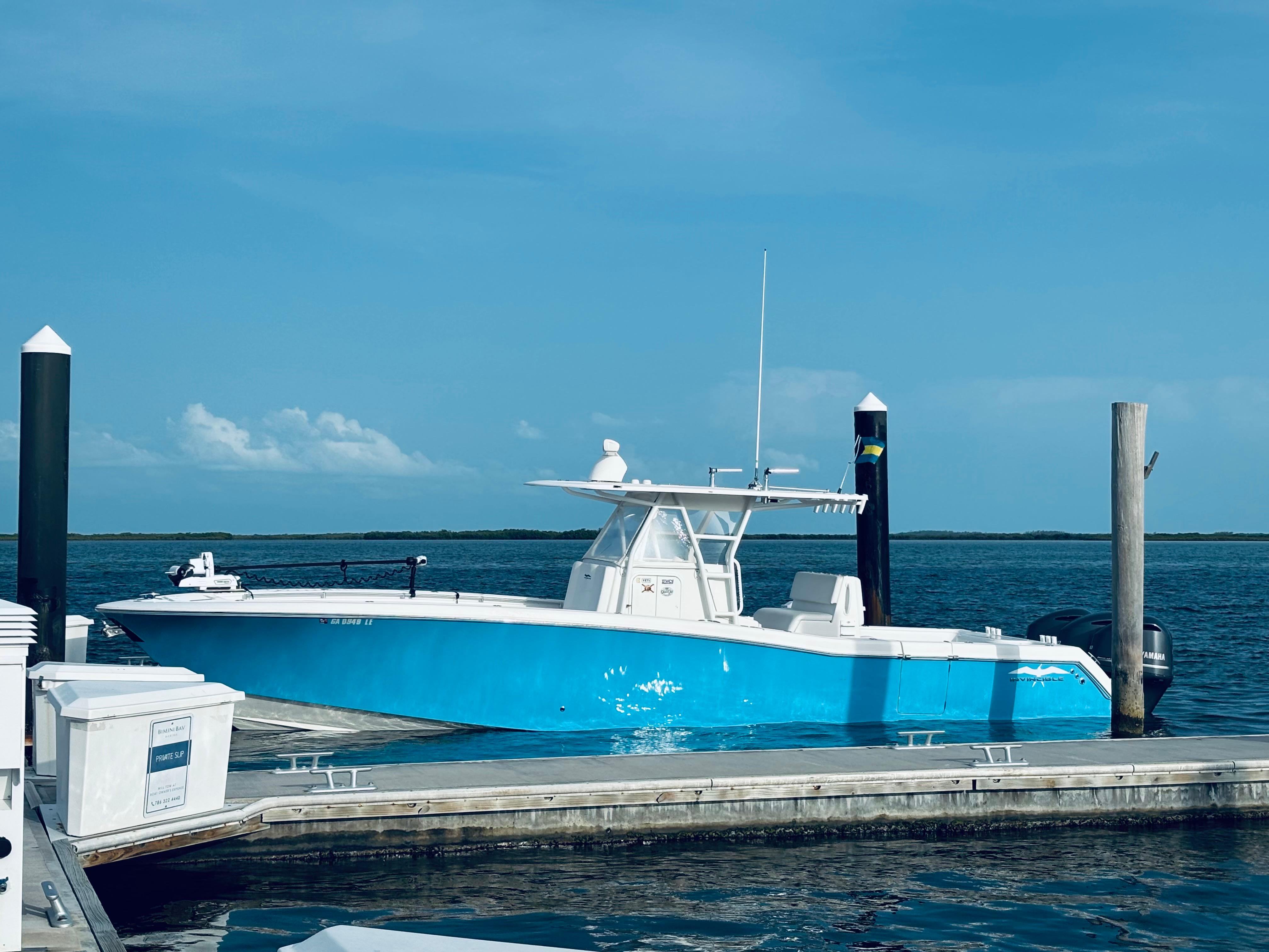 Invincible 36 Open Fisherman 2015 Invincible 36 Open Fisherman boat docked by the ocean.