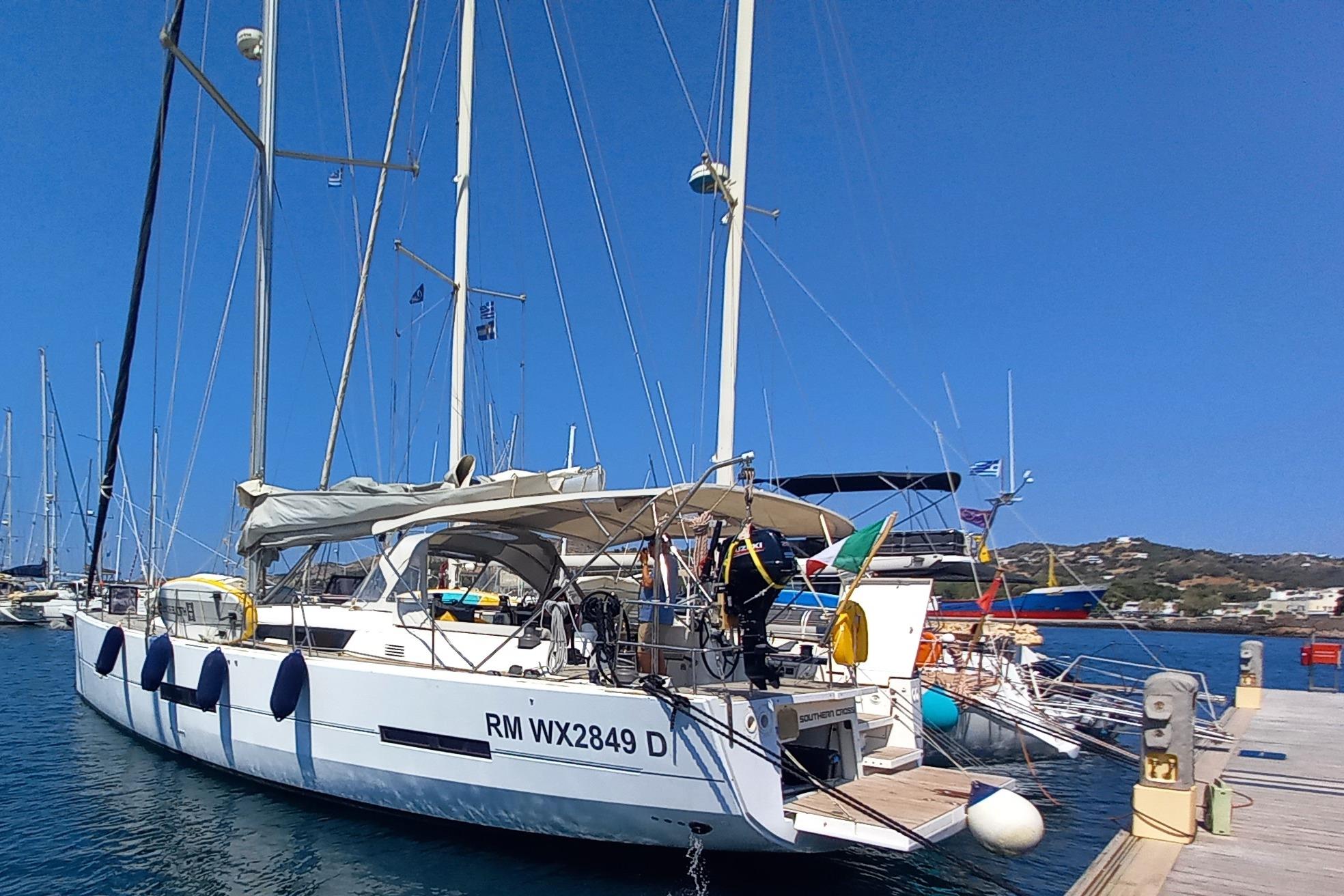 Dufour 560 Grand Large Sailing yacht Dufour 560 Grand Large 2015 docked at a marina under clear blue skies.