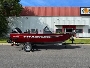 Tracker Pro Guide V-16 WT 2025 Tracker Pro Guide V-16 WT boat on trailer, parked outside a building.