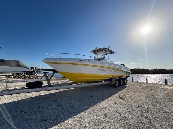 Donzi 29 Zf 2001 Donzi 29 ZF boat on trailer, sunny day by the water.