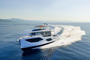 Absolute Navetta 62 2026 Absolute Navetta 62 yacht cruising on open sea, creating a dynamic water trail.