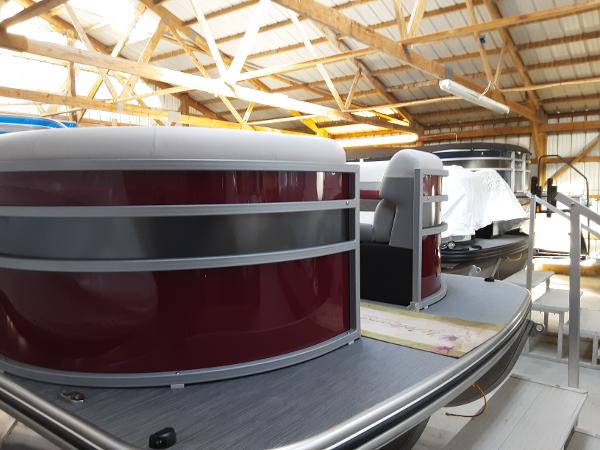 Lowe SS 230 2023 Lowe SS 230 pontoon boat in a storage facility.
