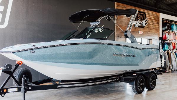 MasterCraft NXT22 2025 MasterCraft NXT22 boat on trailer in showroom.