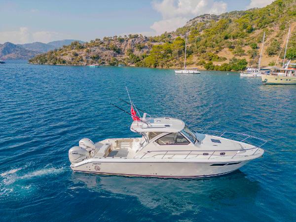 Pursuit OS 355 Offshore 2023 Pursuit OS 355 Offshore boat cruising in scenic coastal waters.