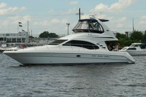 Sea Ray 420 Sedan Bridge 2005 Sea Ray 420 Sedan Bridge yacht on calm water, side view.