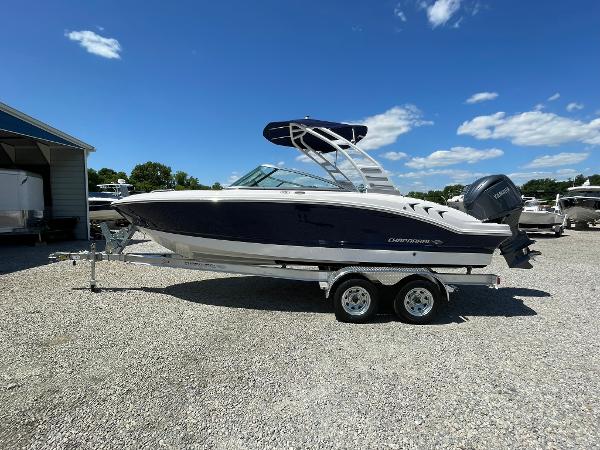 Chaparral 21 SSi OB 2024 Chaparral 21 SSi OB boat on a trailer under a clear blue sky.
