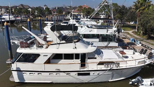 Hatteras 53 Motoryacht 1978 Hatteras 53 Motor Yacht docked in a marina, surrounded by other boats.