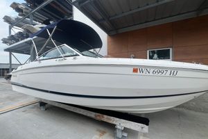 Cobalt R4 2023 Cobalt R4 boat with registration WN 6997 HJ, docked under a shelter.