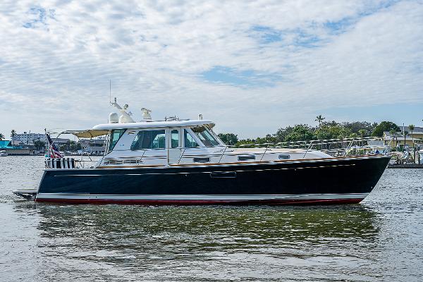 Sabre 48 Salon Express 2012 Sabre 48 Salon Express yacht on calm water under a cloudy sky.