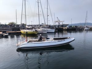 Dariel DT7.5 A 2012 Dariel DT7.5 boat on calm water near a marina with sailboats.