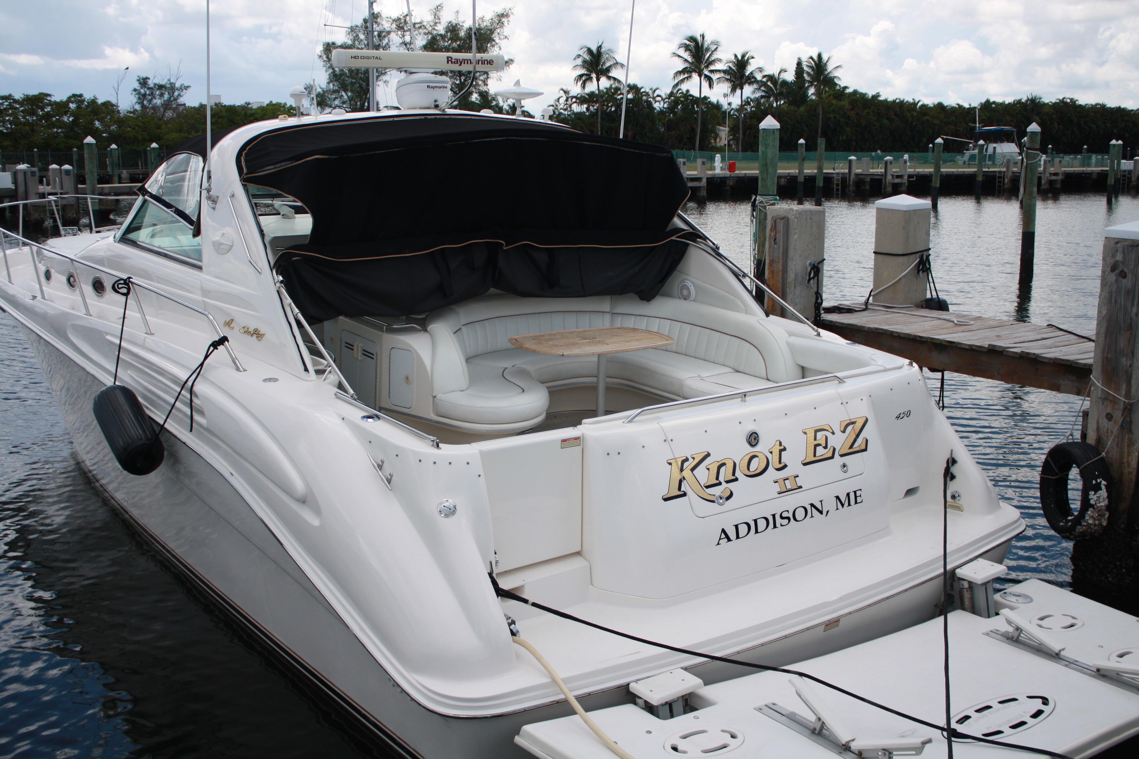 Sea Ray 450 Sundancer 1998 Sea Ray 450 Sundancer yacht docked, featuring spacious seating and elegant design.