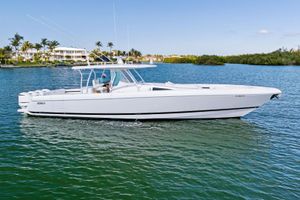 Intrepid 475 Panacea 2015 Intrepid 475 Panacea boat cruising on a sunny day in a scenic waterway.